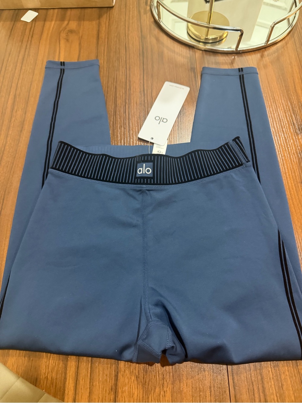 ALO Yoga woman Slate Blue Performance Leggings with Black Stripe